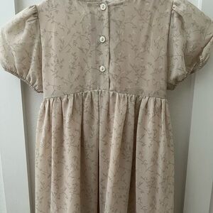 Tan little girls dress with puff sleeves super cute!